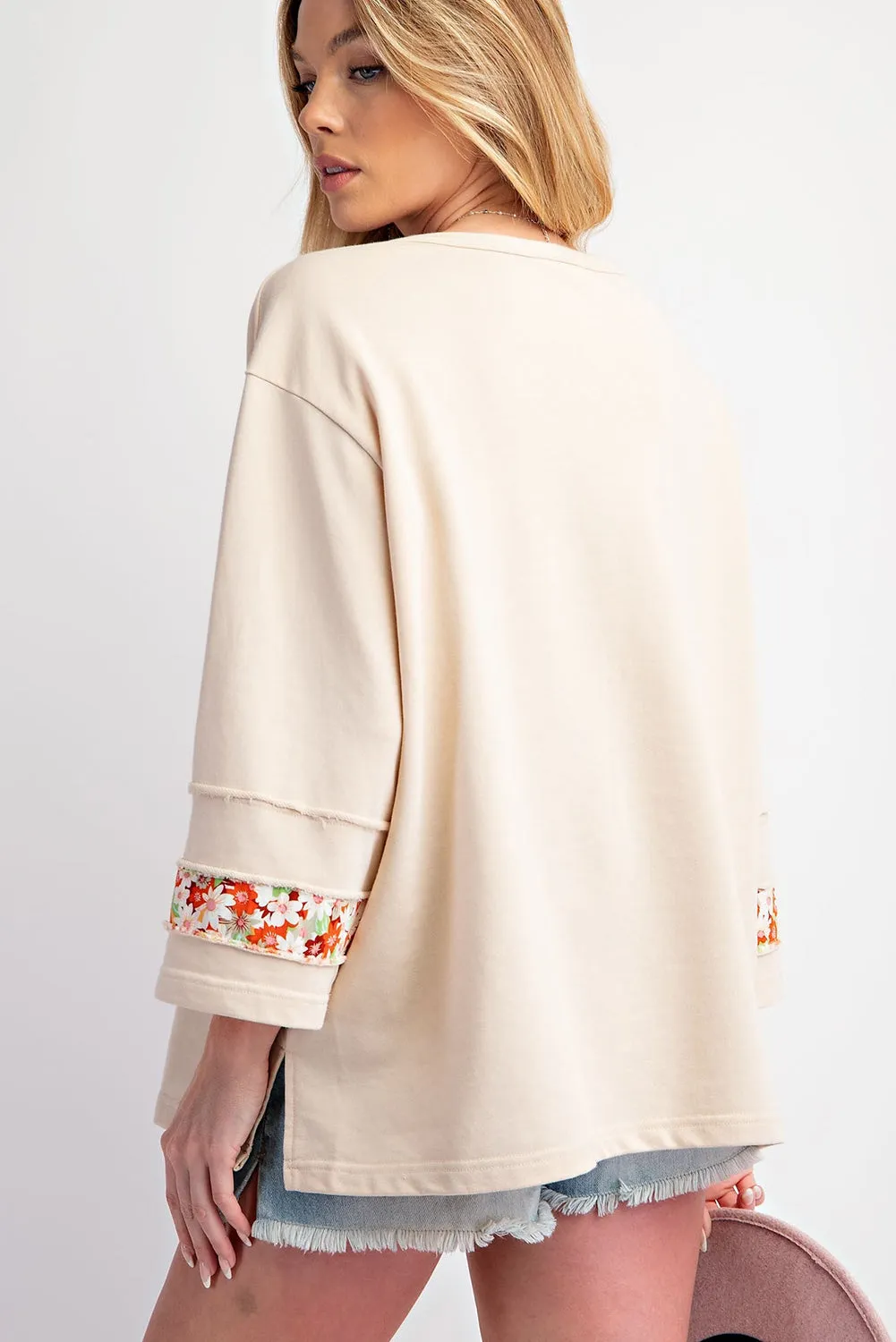 Flower Patch Graphic Exposed Seam Wide Sleeve Top